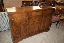 REPRODUCTION ARTS & CRAFTS STYLE SIDEBOARD WITH DECORATIVE CARVING, LENGTH APPROX 137CM