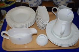 CERAMIC WARES DECORATED IN WHITE, INCLUDING VARIOUS JUGS, BOWLS, PLATES ETC