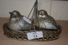 CRUET SET MODELLED IN METAL AS TWO BIRDS IN BASKET