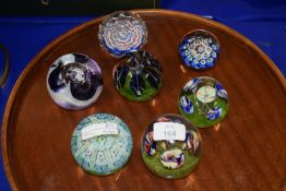 TRAY CONTAINING SEVEN PAPERWEIGHTS