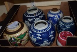 BOX OF CHINESE CERAMICS INCLUDING THREE JARS WITH PRUNUS DECORATION ON BLUE GROUND AND A CRACKLE