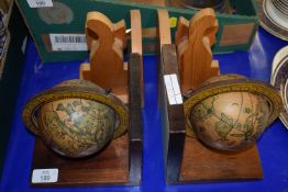 PAIR OF BOOKENDS MODELLED AS GLOBES AND FURTHER WOODEN PAIR OF BOOKENDS