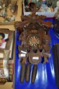 CUCKOO CLOCK MODELLED IN TYPICAL FASHION, THE CLOCK FLANKED BY DEAD GAME WITH A DEER'S HEAD ABOVE