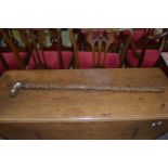 BONE HANDLED WALKING CANE MOUNTED WITH WHITE METAL WITH ROCOCO STYLE DECORATION AROUND THE VACANT