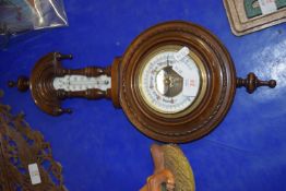 BAROMETER IN CIRCULAR MAHOGANY CASE WITH THERMOMETER ABOVE