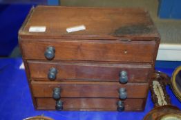 SMALL WOODEN CHEST OF DRAWERS CONTAINING BEADS AND WRIST WATCH