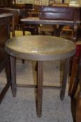 BRASS BENARES TYPE FOLDING TABLE WITH MOULDED DECORATION DEPICTING STYLISED MYTHICAL BIRDS, APPROX