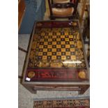 GLASS TOPPED HARDWOOD GAMES OR COFFEE TABLE, APPROX 61 X 89CM