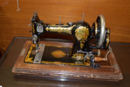 GOOD QUALITY JONES' HAND CRANKED SEWING MACHINE IN WOODEN CASE