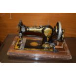 GOOD QUALITY JONES' HAND CRANKED SEWING MACHINE IN WOODEN CASE