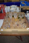 TRAY CONTAINING GLASS WARES INCLUDING SET OF ENGRAVED WINE GLASSES WITH GREEN STEMS