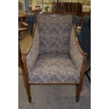 EDWARDIAN UPHOLSTERED BERGERE CHAIR RAISED ON TAPERED LEGS, WITH STRUNG DECORATION, WIDTH APPROX