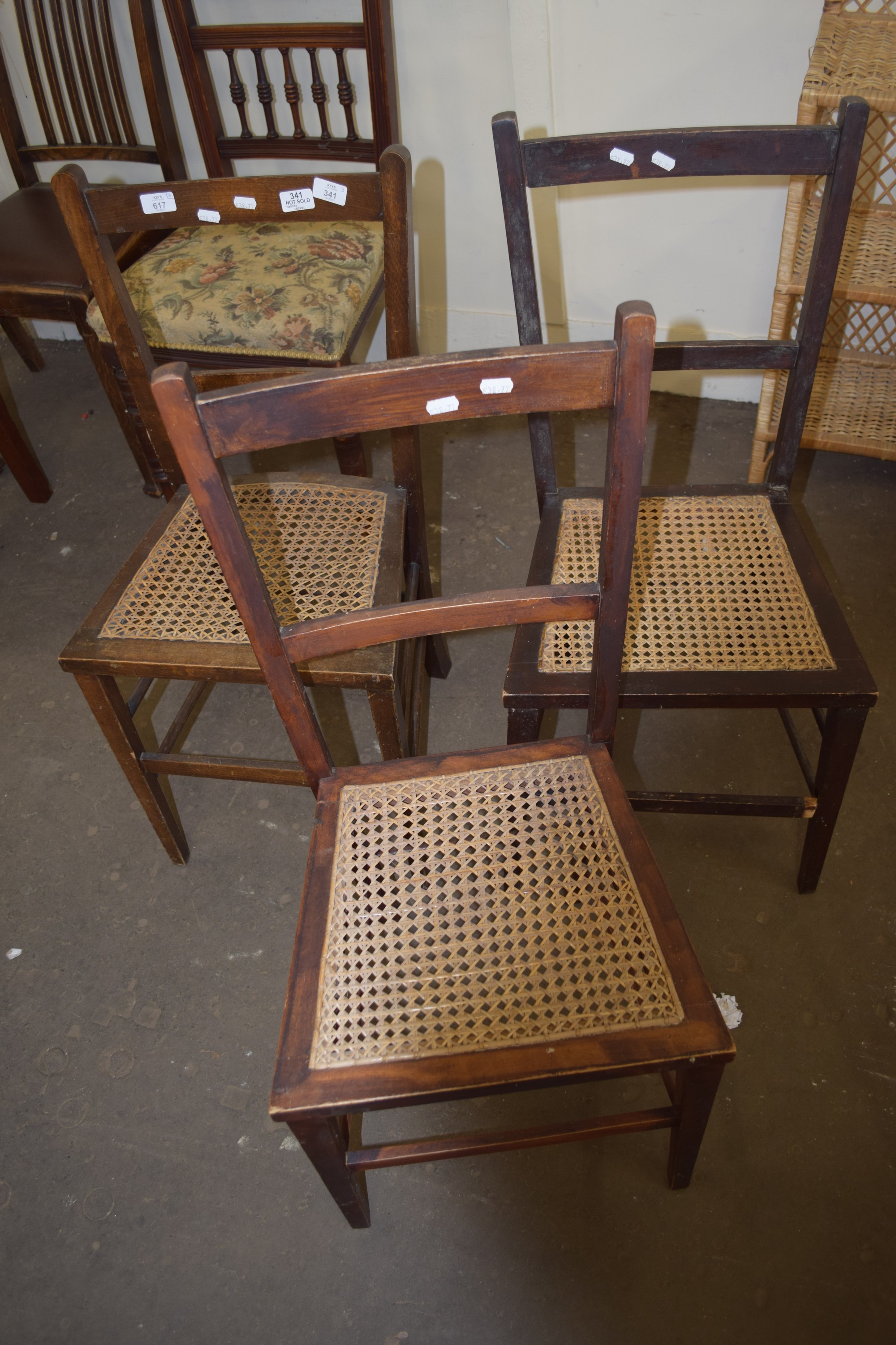 THREE STICK BACK AND RUSH SEATED WOODEN CHAIRS
