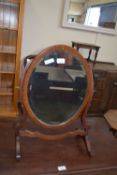 EARLY 20TH CENTURY BEVELLED GLASS OVAL SWING MIRROR, 58CM HIGH