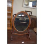 EARLY 20TH CENTURY BEVELLED GLASS OVAL SWING MIRROR, 58CM HIGH