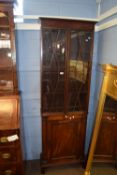 Full height Edwardian pier cabinet, the cupboard topped with an astragal glazed bookcase, width