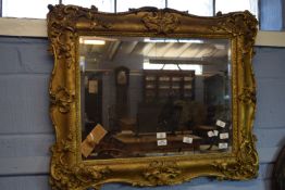 19th century gilt and gesso picture frame (now fitted as a mirror), moulded with C-scrolls and