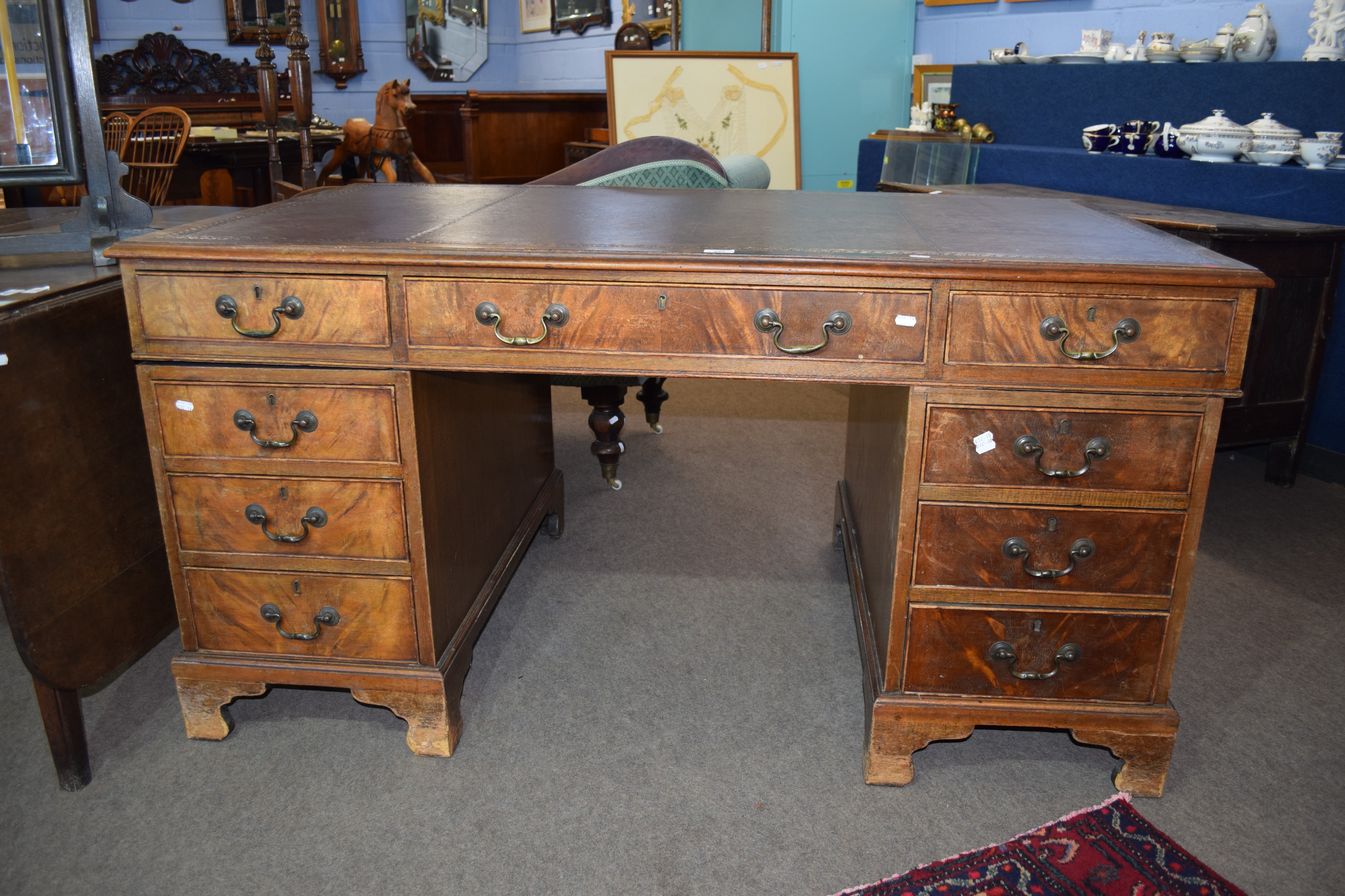 19th century leather top mahogany twin pedestal desk, the central drawer flanked by two pedestals of