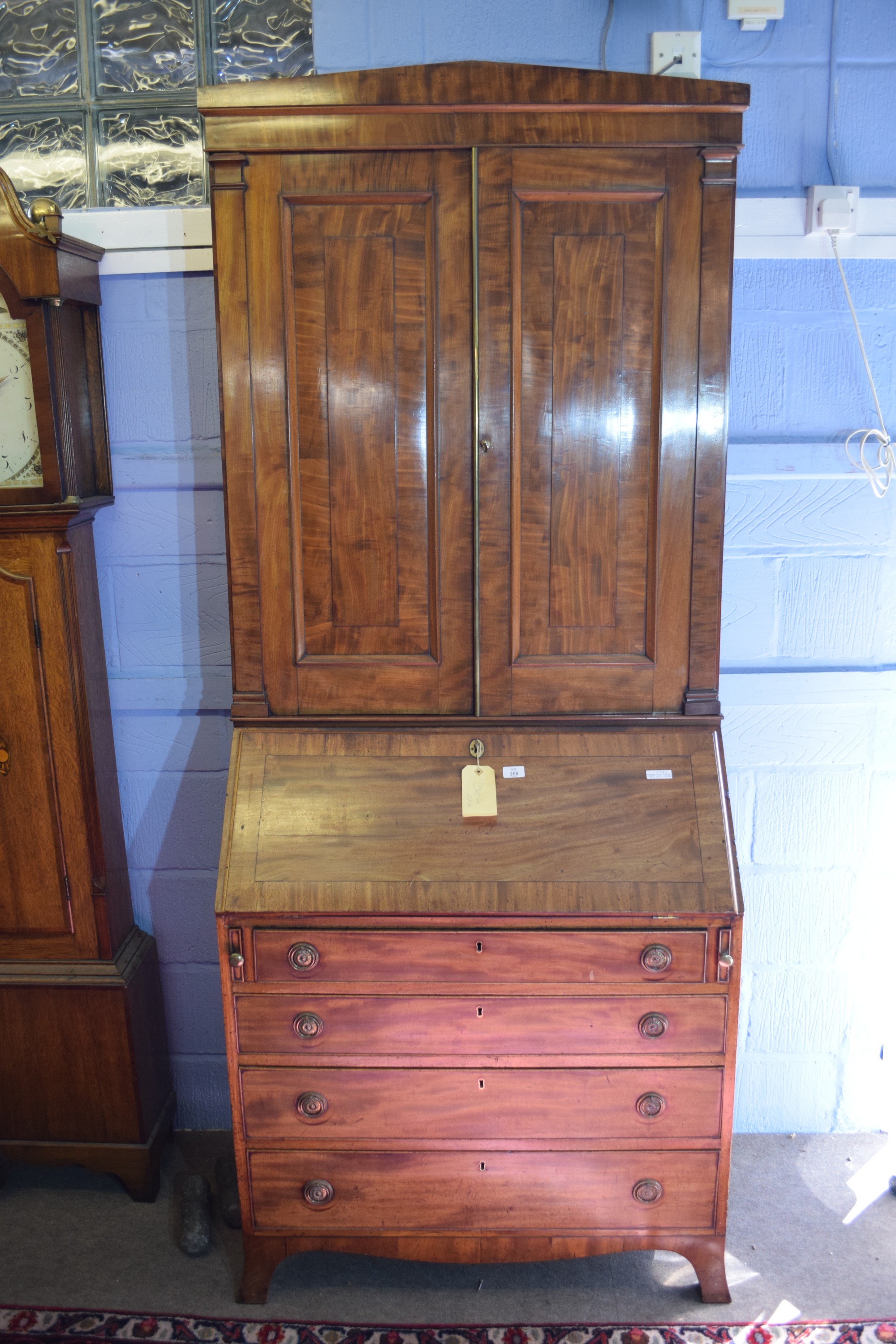 Mid-19th century mahogany bureau bookcase, the fall front interior partially fitted, raised over