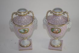 Pair of vases in Sevres style with landscape scenes, the bodies flanked with rams head terminals