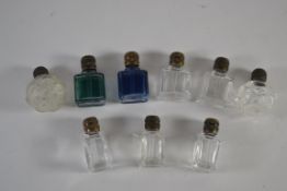 Small bag containing a quantity of small glass bottles with metal mounts, the glass of clear and