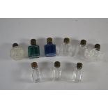 Small bag containing a quantity of small glass bottles with metal mounts, the glass of clear and