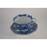 Chinese porcelain octagonal cup and saucer decorated in blue and white in Kangxi style with reign