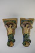 Two late 19th century Continental Majolica wall pockets decorated in typical glazes with mermaids,