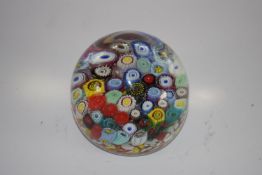 Murano paperweight with variety of multi-coloured canes