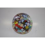 Murano paperweight with variety of multi-coloured canes