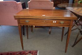 Early 19th century mahogany fold-top tea table, raised on tapered legs with full length drawer