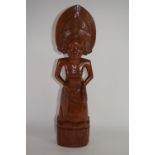 Carved figure, of Eastern (possibly Indonesian) origin, depicting a female wearing an ornate