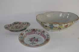 Group of Chinese porcelain wares decorated in enamels in famille rose palette comprising a shaped