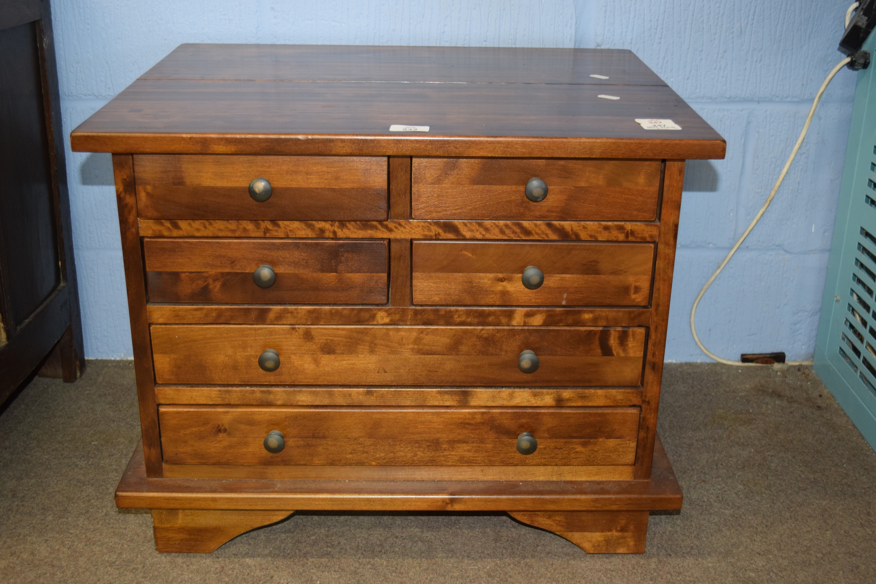 20th century hardwood chest of two, two and two drawers, with metal knob handles, 62cm wide x 50cm