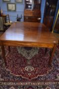 Georgian style mahogany D-end dining table with single centre leaf and brass clips, raised on