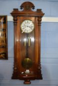 Vienna type wall clock of typical form in decoratively carved mahogany case, the dial signed GB,