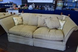 20th century Knole style two/three seater settee upholstered in beige fabric, having rope tied