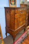 Early 19th century veneered chest on stand with strung and cross banded decoration, 100cm max