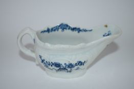 Small Lowestoft porcelain cream boat decorated in blue and white with a version of the two porter