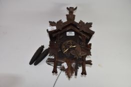 Early 20th century Black Forest cuckoo clock, case height max 31cm, typical decoration mounted