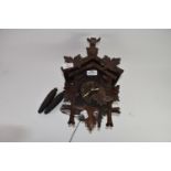 Early 20th century Black Forest cuckoo clock, case height max 31cm, typical decoration mounted