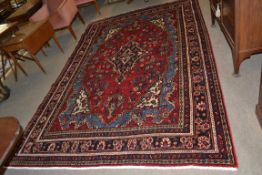 Rich red ground full pile Persian Serouke Carpet, floral medallion design 296cm x 200cm approximate