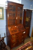 Late Georgian mahogany bureau bookcase, the top section with concave sided cornice above two glass