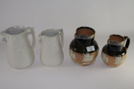 Group of 19th century jugs including two Copeland jugs, decorated in white in relief with acorns and