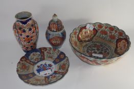 Group of Japanese porcelain with Imari designs comprising a shaped bowl, further small dish, a