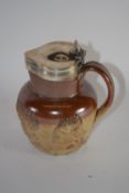 Mid-19th century pottery jug, the buff body with decoration in relief with silver rim and cover, the