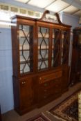 Impressive mahogany effect reproduction break front secretaire bookcase in the George II style,
