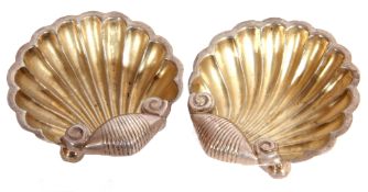 Pair of late Victorian small salts of shell form, each supported on three ball feet, 5cm x 5cm,