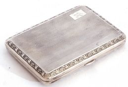 George V silver cigarette case of rectangular form, engine turned decoration back and front with