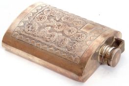 Foreign white metal hip flask of curved rectangular form with screw down hinged lid, embossed with